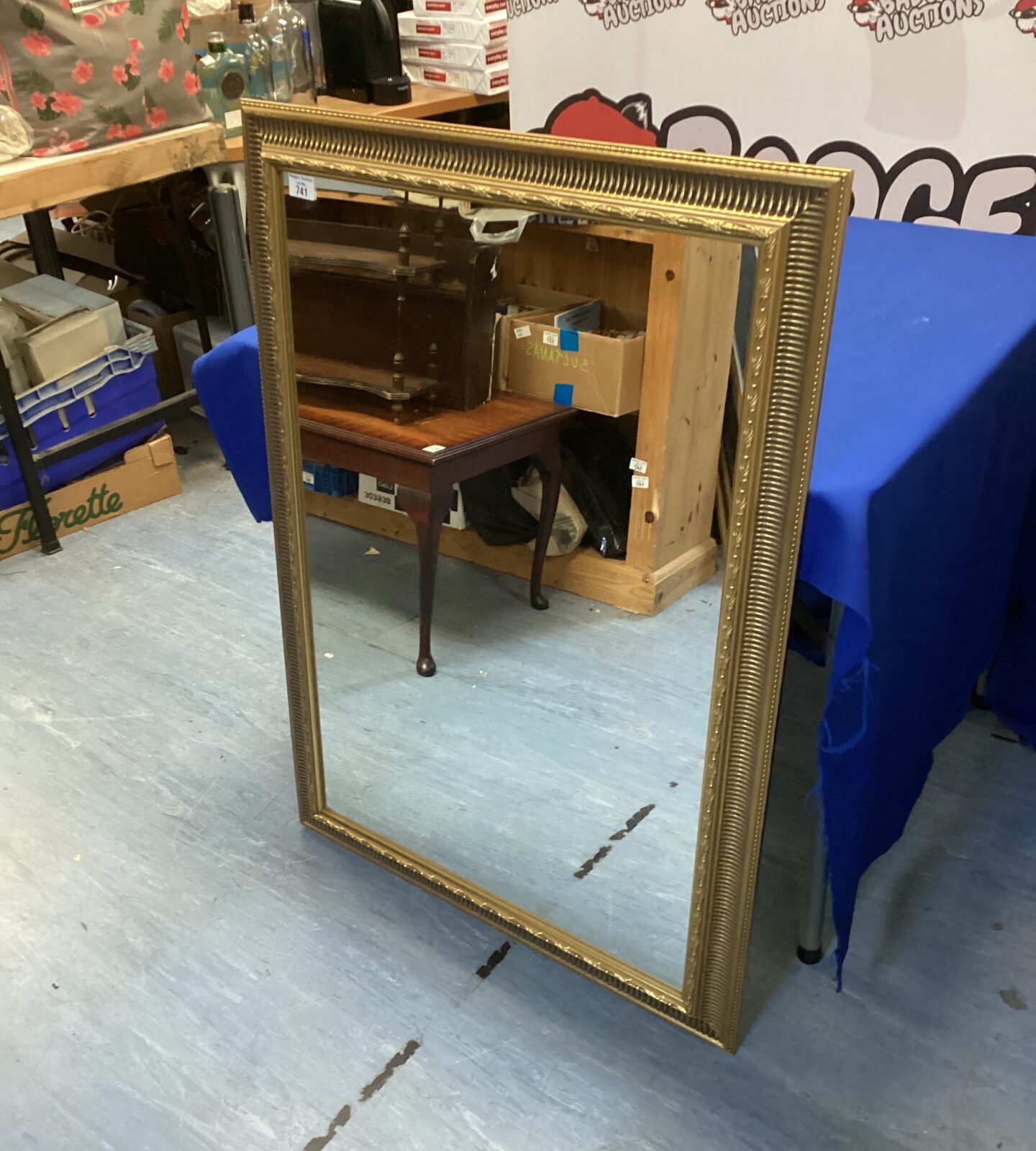 Ornate gilt framed mirror measuring 41” x 29” for wall decor.