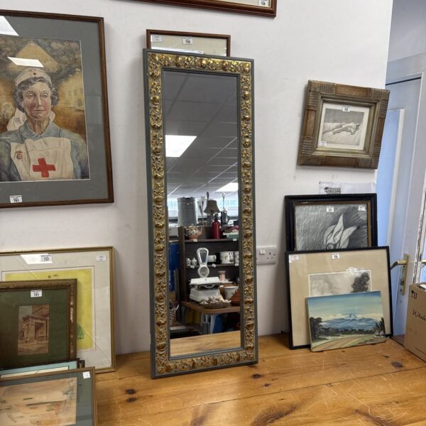 Ornate gilt framed full length mirror for home decor.