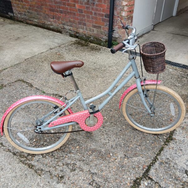 Girls Pendleton Hanberry bicycle with wicker basket, vintage style.