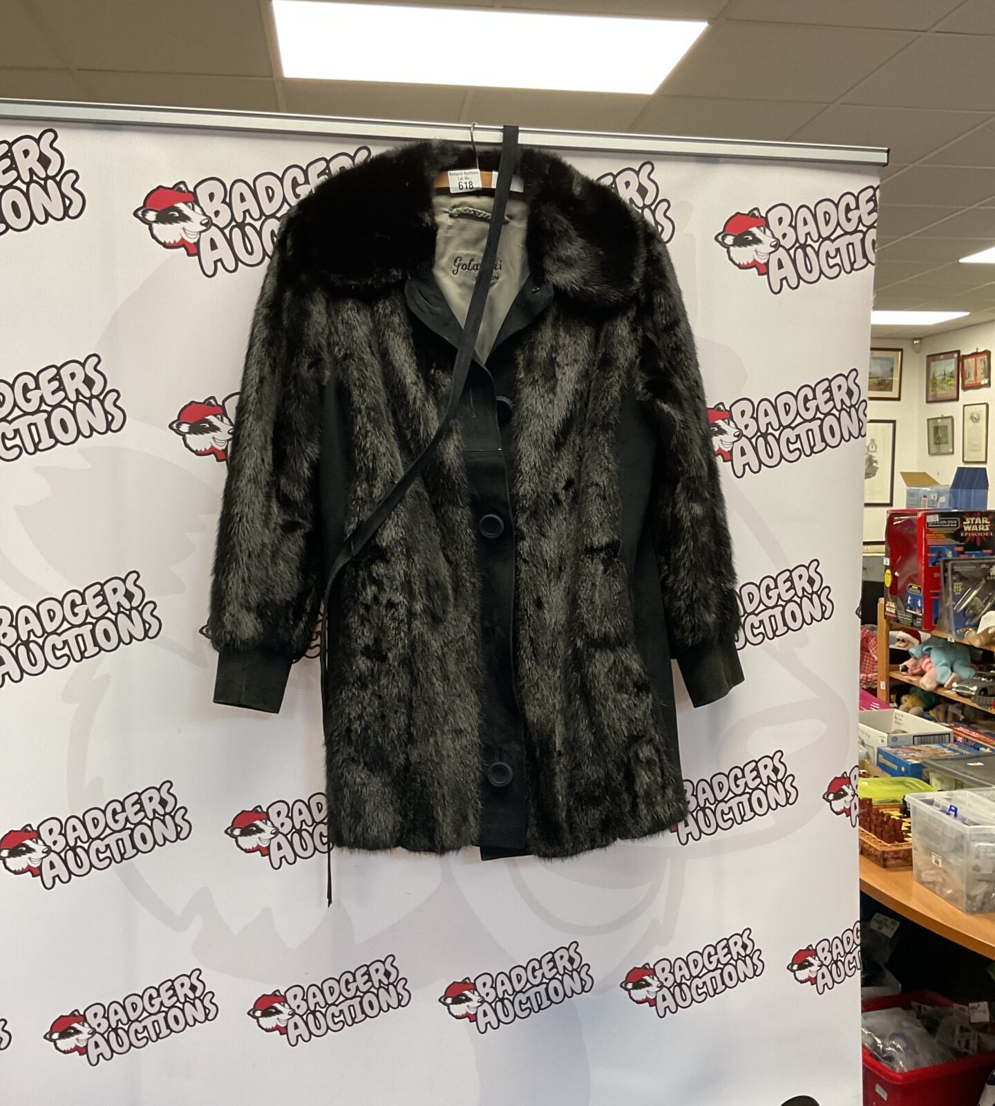 Front view of a luxurious Golanski London faux fur coat.