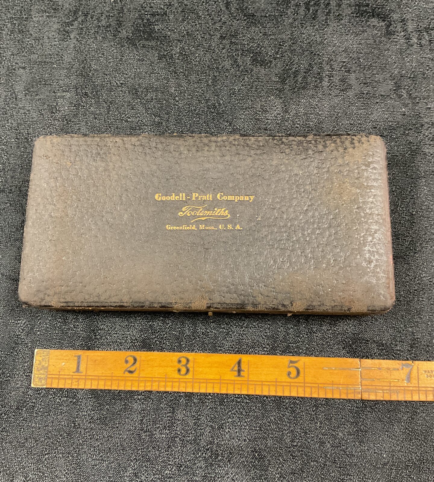 Vintage Goodell Pratt depth micrometer with a ruler for scale.