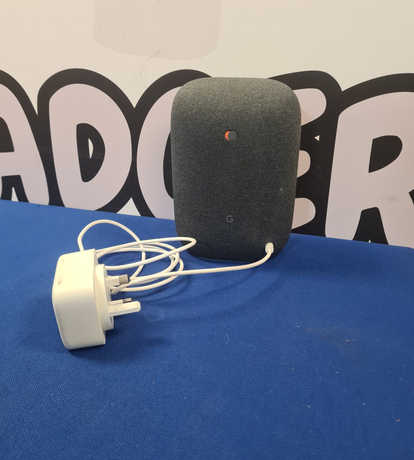 Google Nest Audio smart speaker in grey fabric.