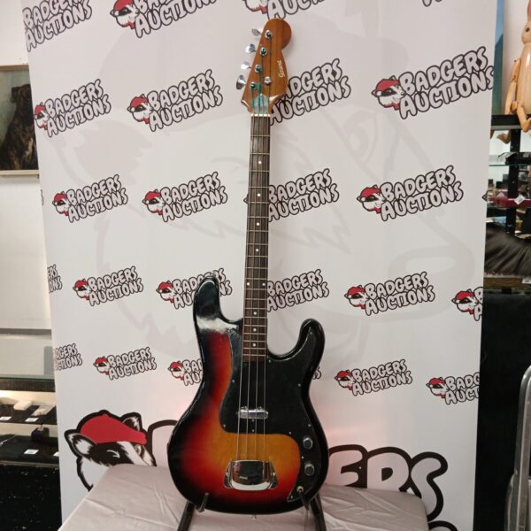 Vintage Grant sunburst bass guitar, detailed view.