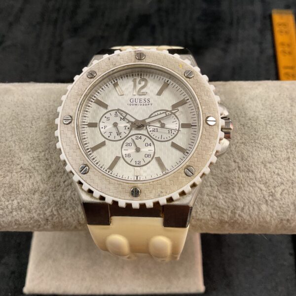 Stylish Guess quartz wristwatch with stainless steel band and face.