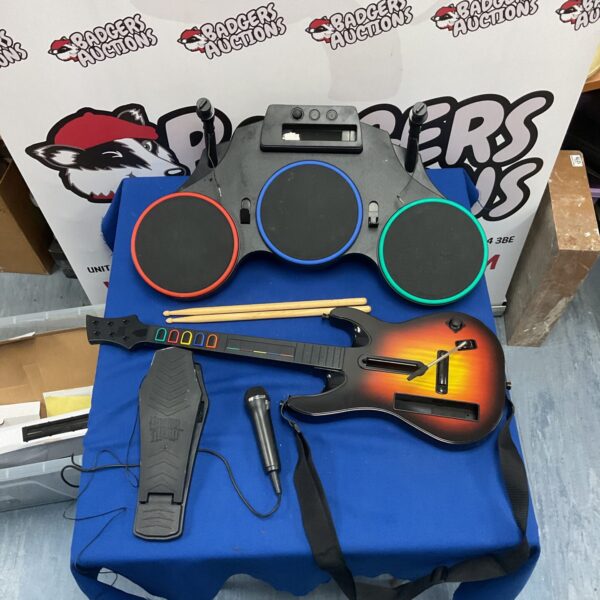 Complete Guitar Hero bundle with guitar, drum kit, and microphone.