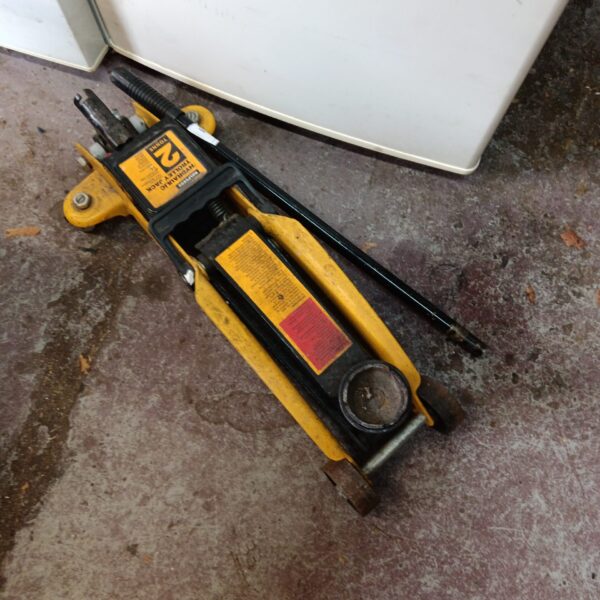 Used Halfords 2 tonne trolley jack for car maintenance.