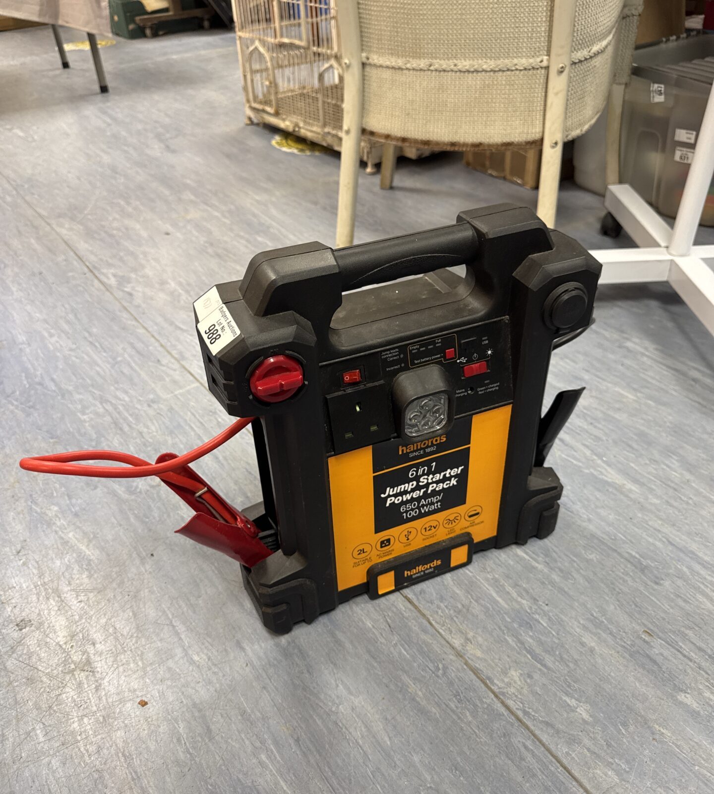 Halfords 6-in-1 jump starter pack, showing the device and controls.