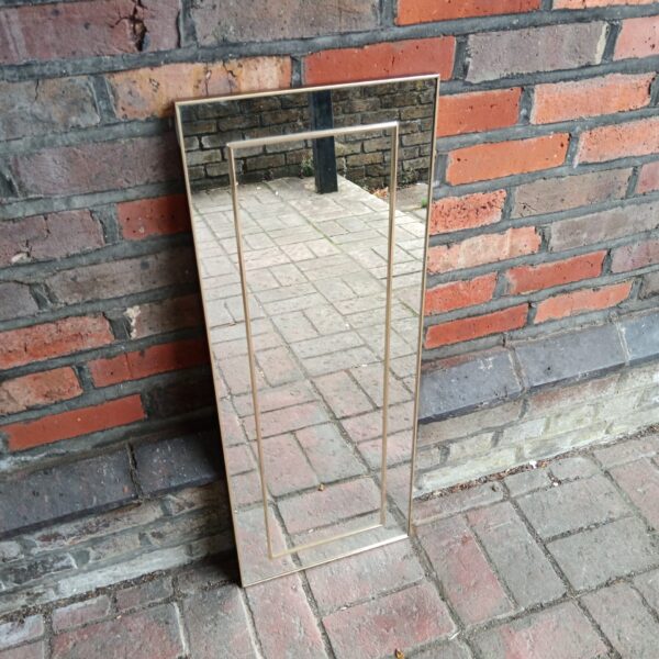Modern rectangular hall mirror with gold frame.