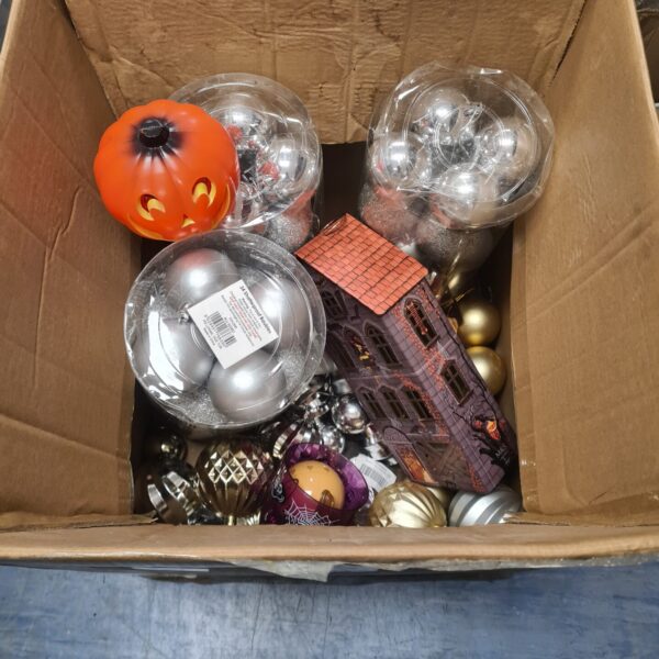 Mixed lot of Halloween and Christmas ornaments with bauble packs.