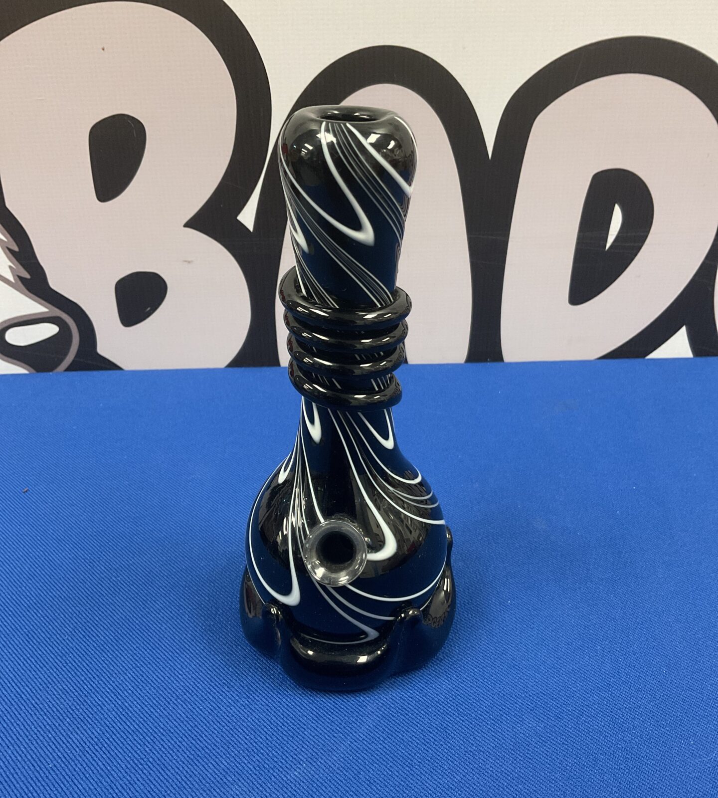 Stunning hand blown glass chillum pipe with black and white swirl design.
