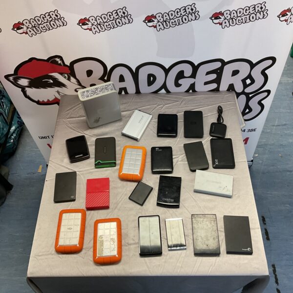 Mixed lot of internal hard drives for computer repair and data storage.