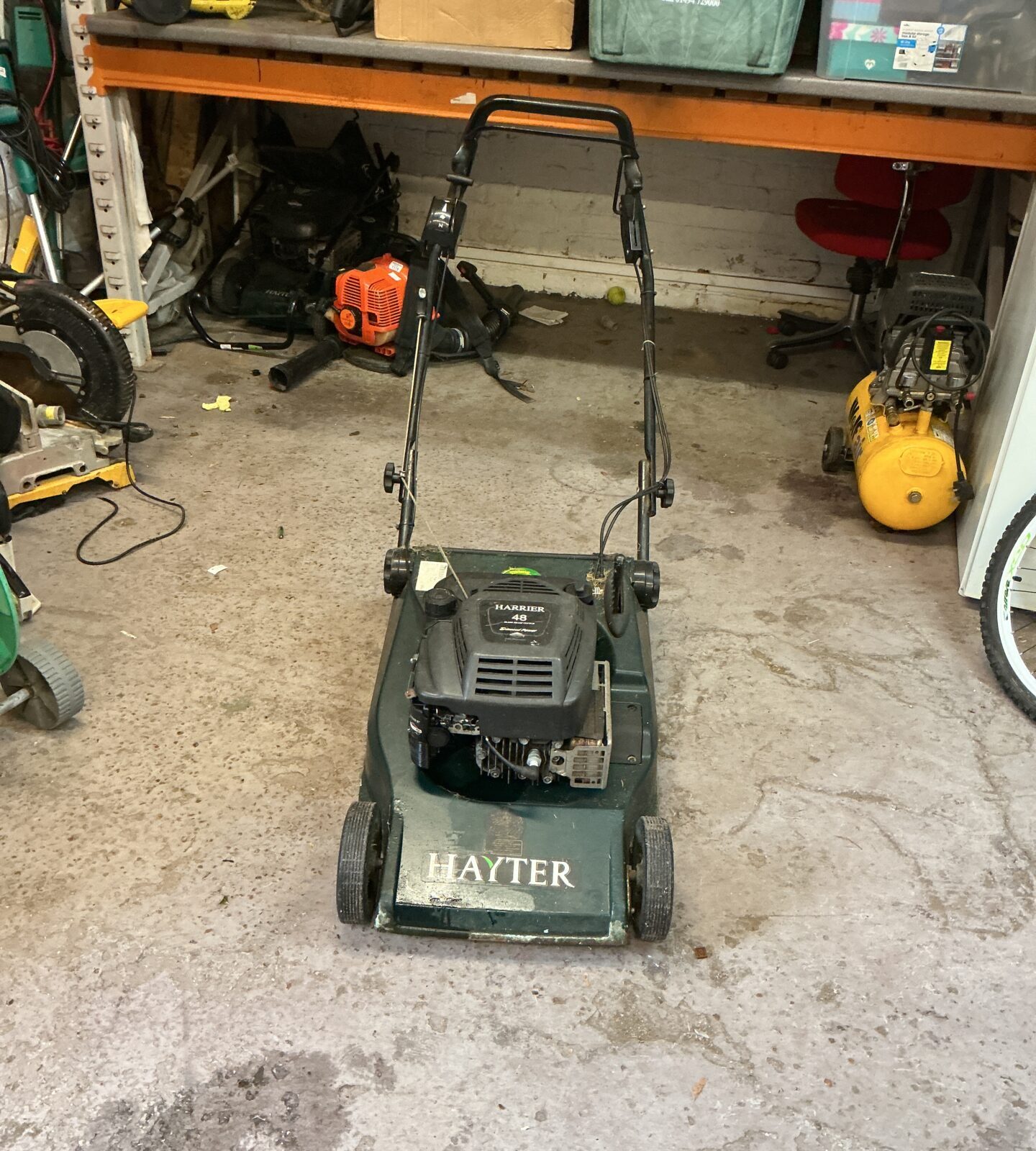 Vintage Hayter 48 petrol lawn mower in used condition.