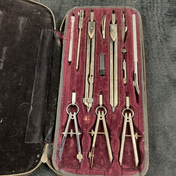 Vintage Hellerman drawing instrument set displayed open in its fitted case.