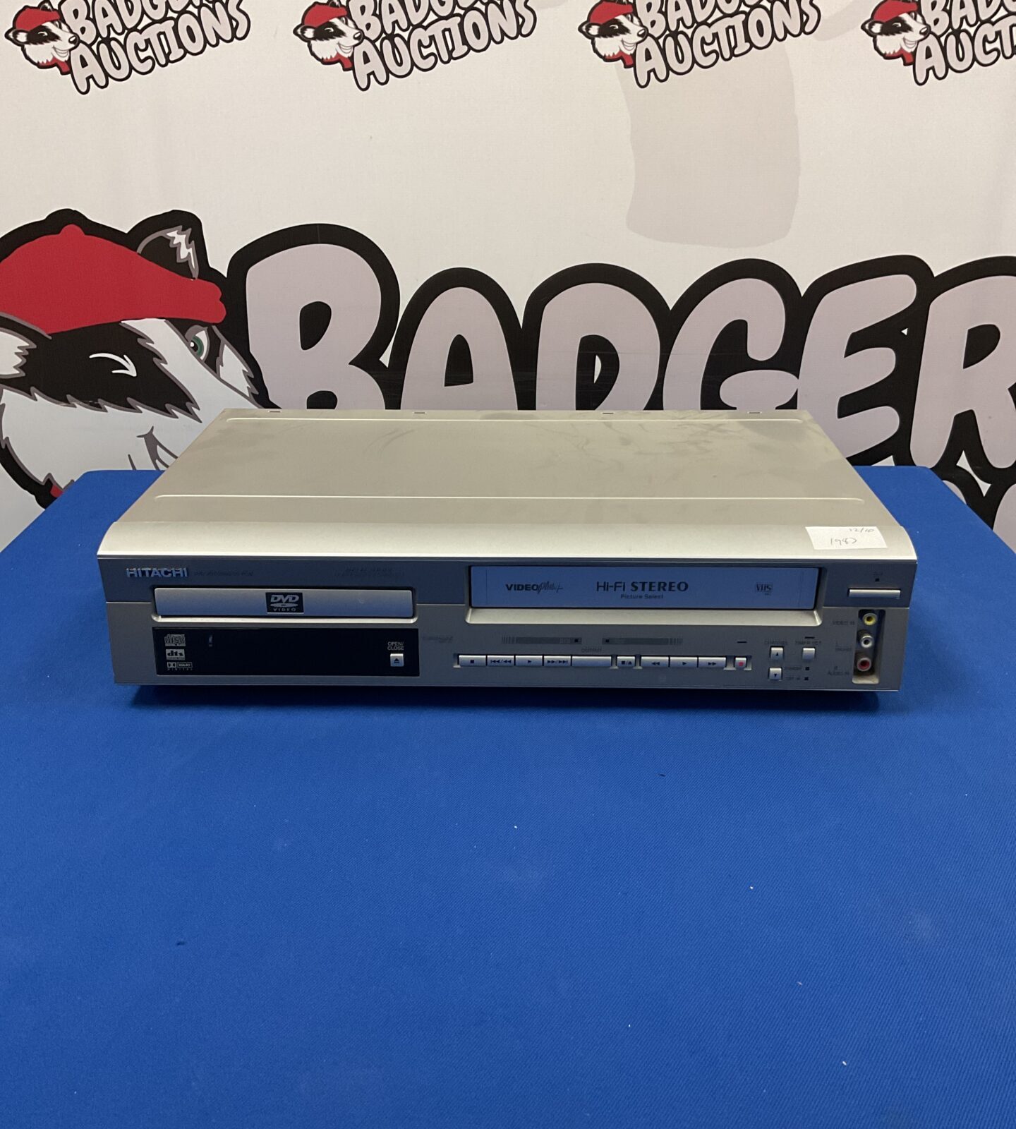 Silver Hitachi DV-PF2E DVD/VCR combo player for retro entertainment.