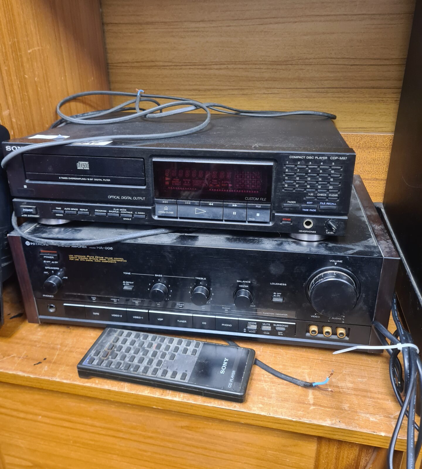 Vintage Hitachi stereo system with Sony CD player and remote control.