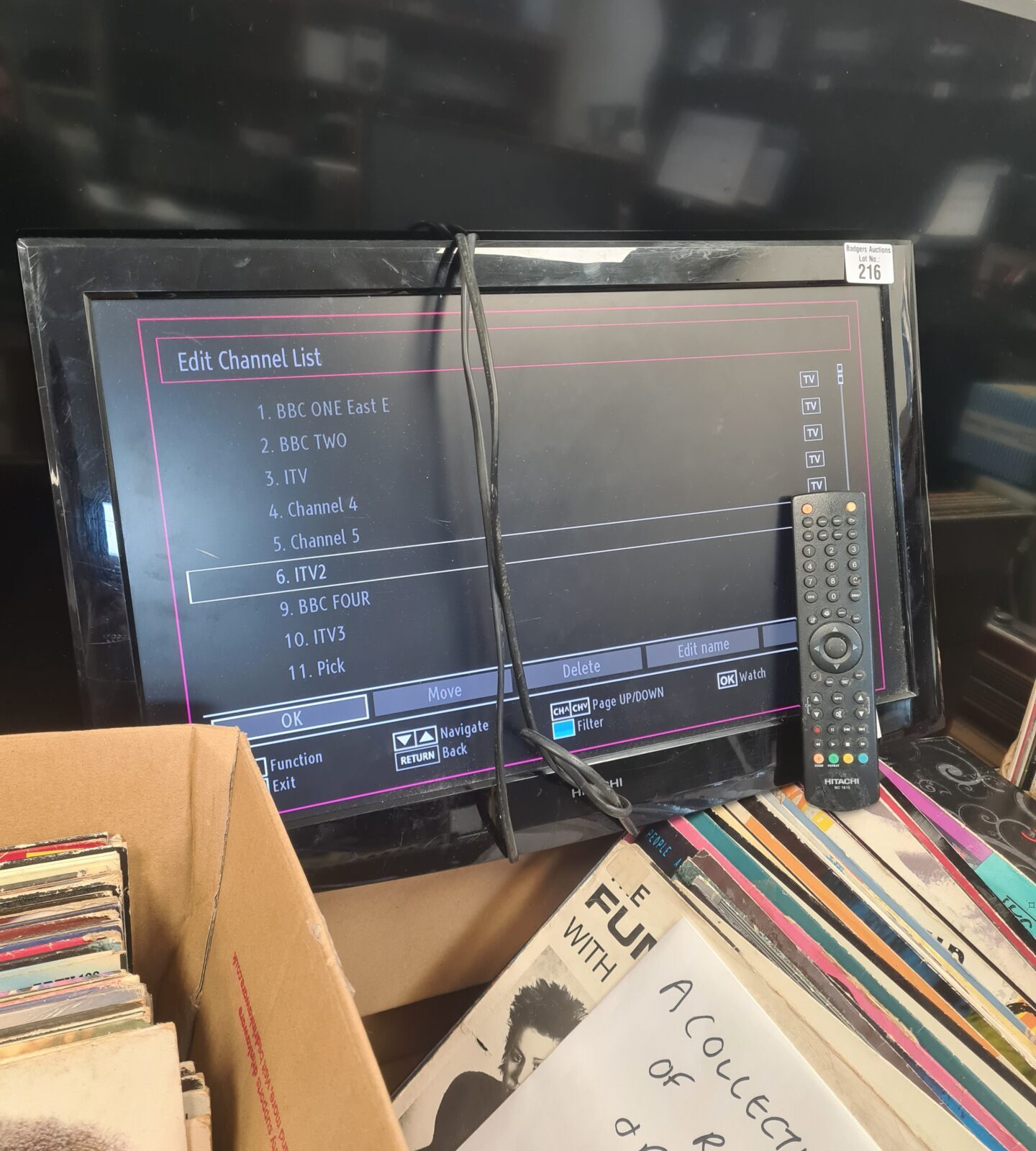 Working vintage Hitachi television with remote control.