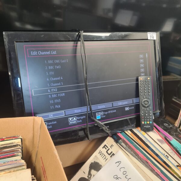 Working vintage Hitachi television with remote control.