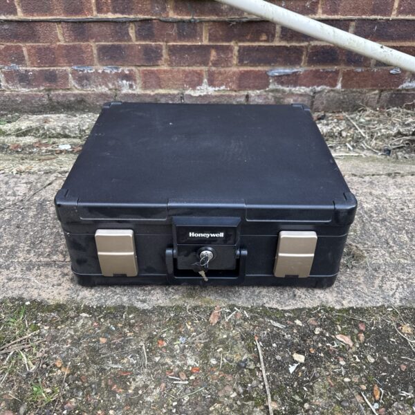 Honeywell firesafe document box with key lock for secure storage.