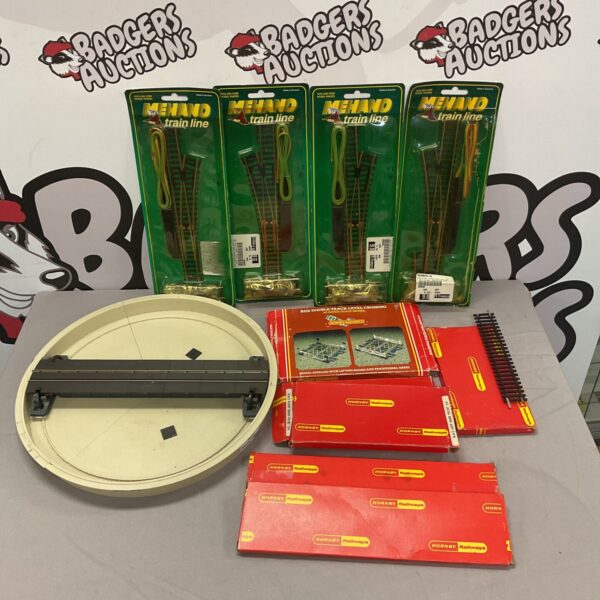 Sealed boxes of new Hornby track pieces for model railways.