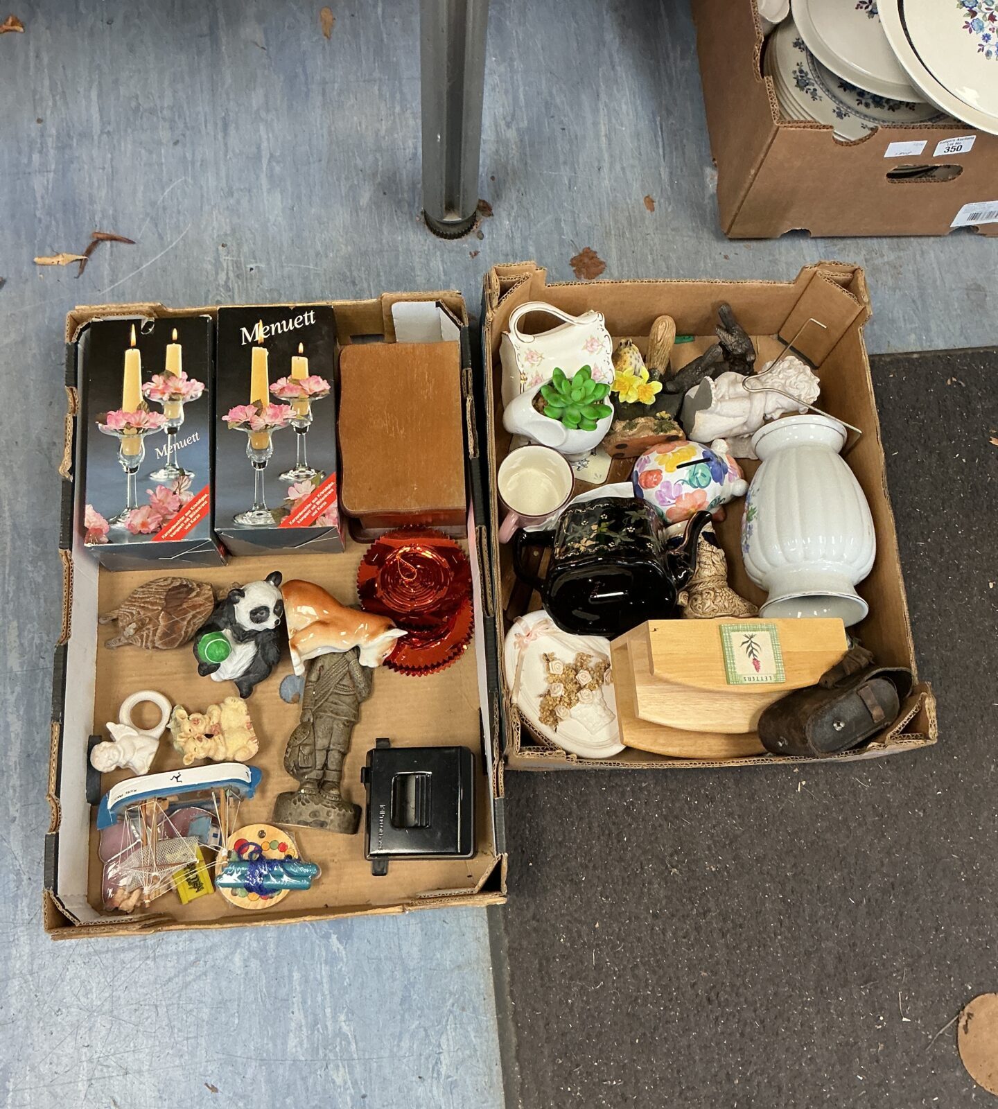 House clearance lot with candle holders and vintage collectibles.