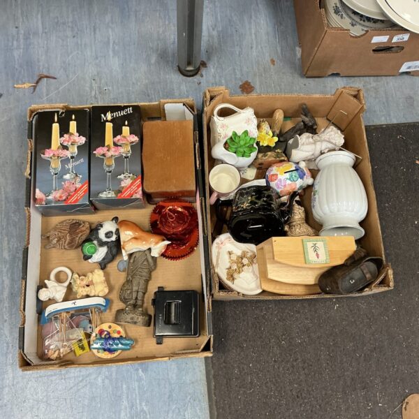 House clearance lot with candle holders and vintage collectibles.
