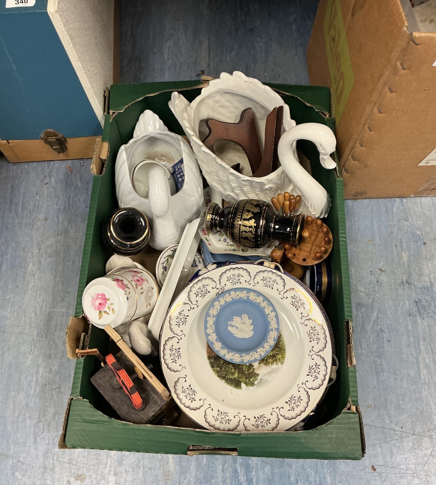 Vintage house clearance lot with swan pottery and ceramics.