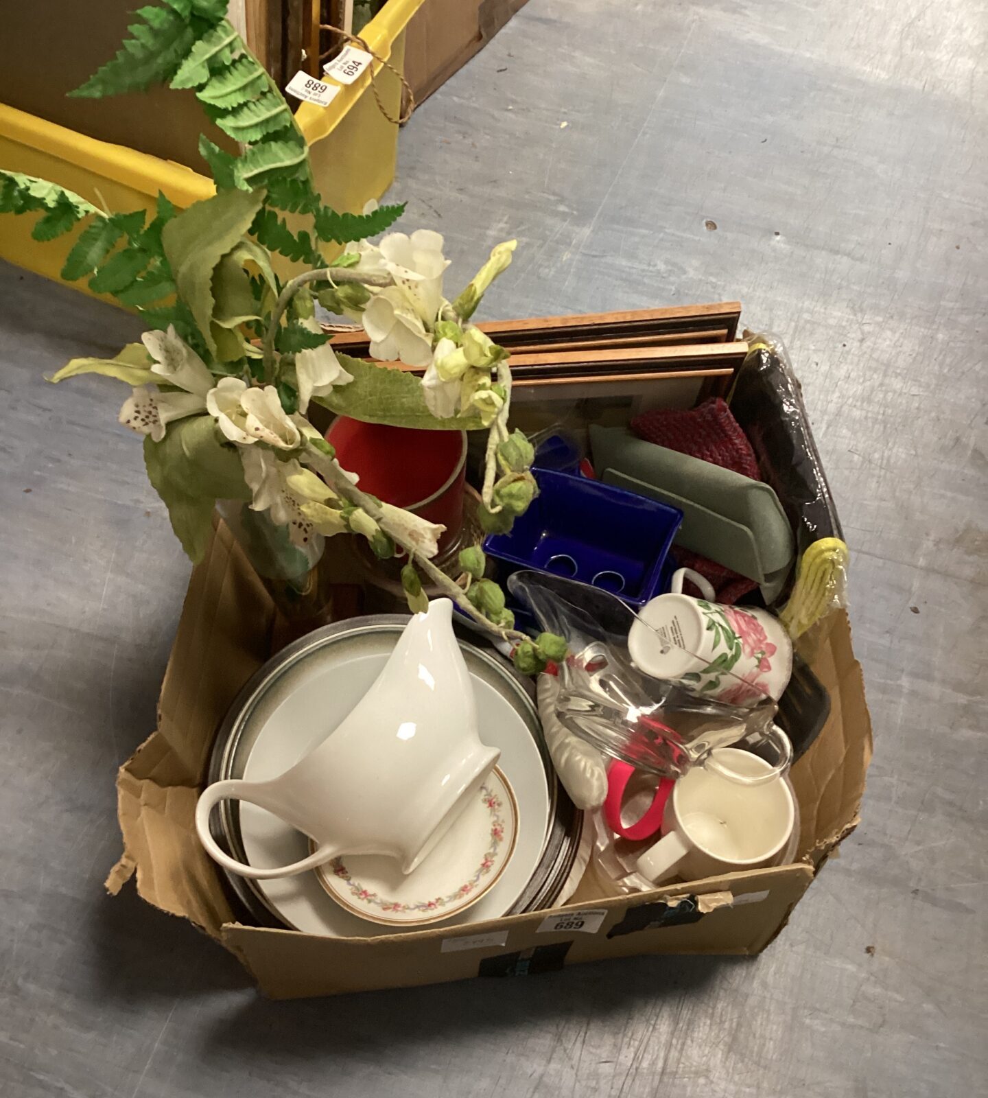Mixed house clearance lot with gravy jugs and artificial flowers.