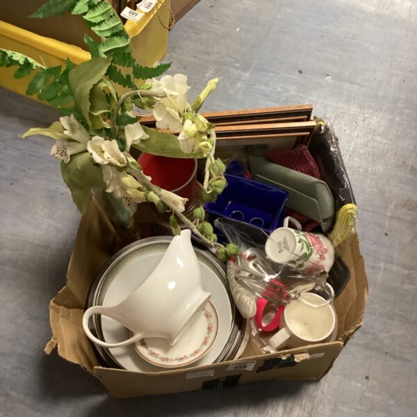 Mixed house clearance lot with gravy jugs and artificial flowers.