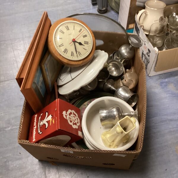 House clearance lot with pewter tankards and glassware on display.