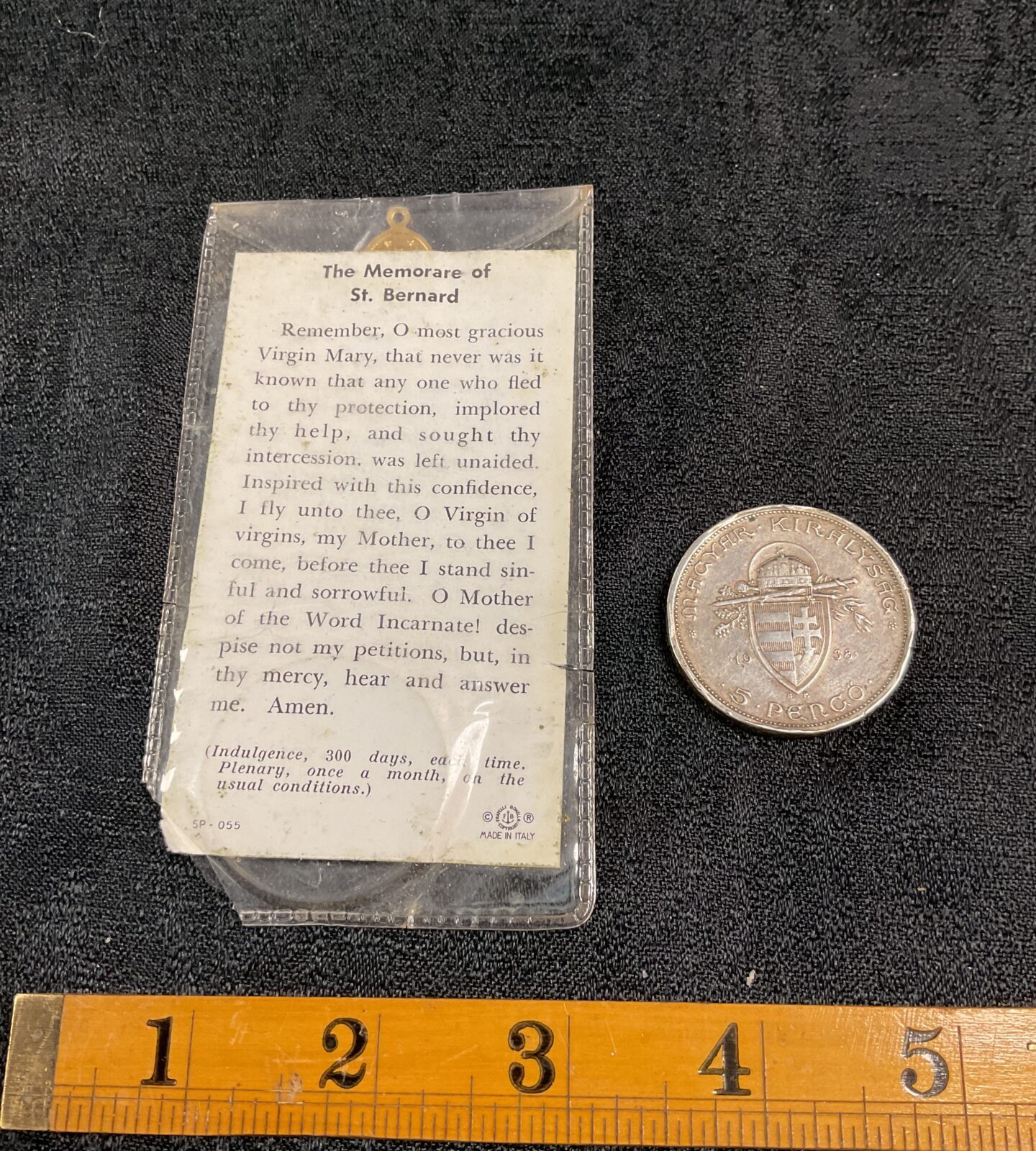 Close-up of Hungarian 5 Pengo coin and Memorare card details.