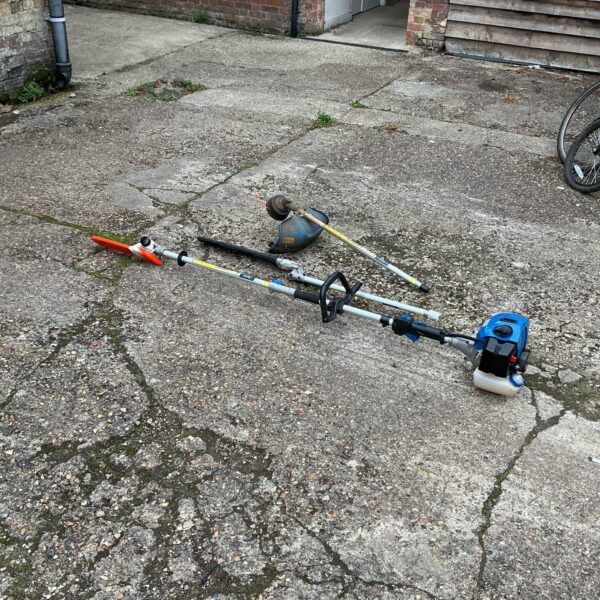 Hyundai petrol garden multi tool showing attachments.