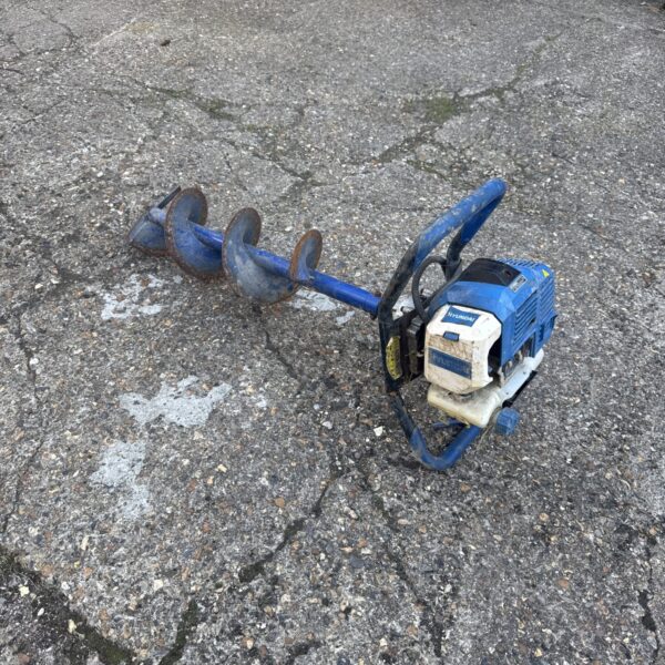 Hyundai petrol post hole borer with auger bit.