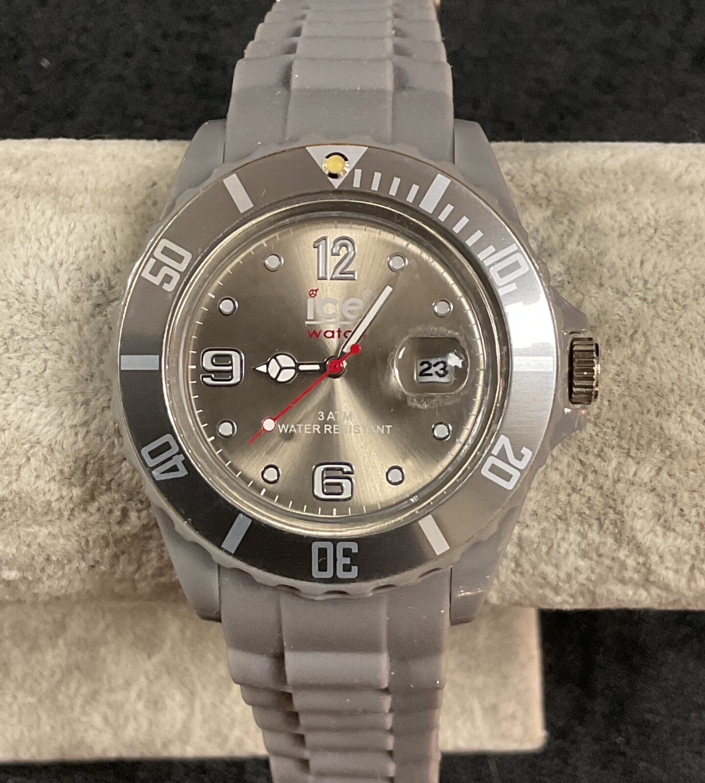 Silver tone Ice Quartz wristwatch with clear face.