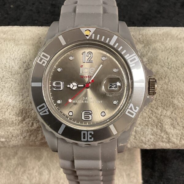 Silver tone Ice Quartz wristwatch with clear face.