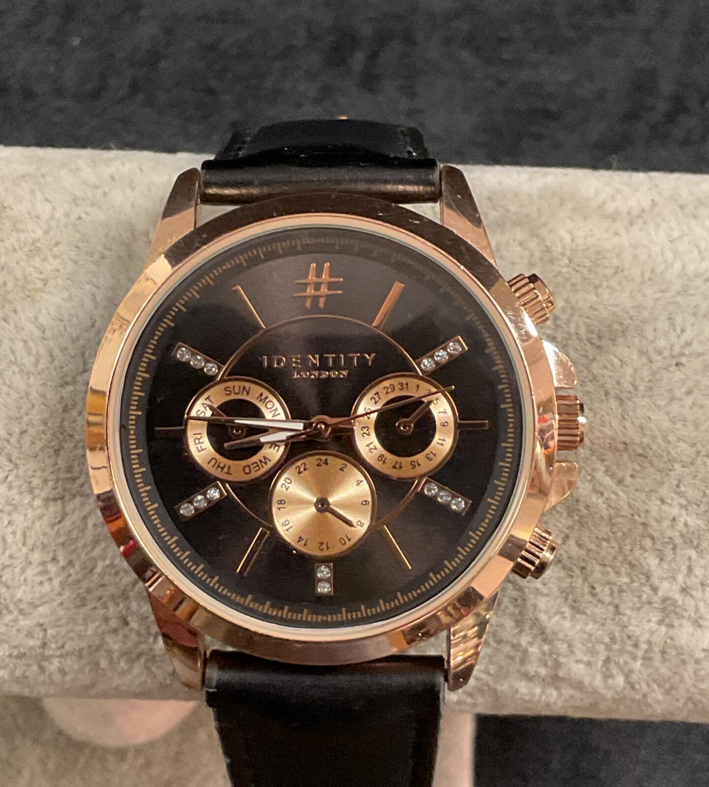 Stylish Identity London quartz wristwatch with black leather strap.