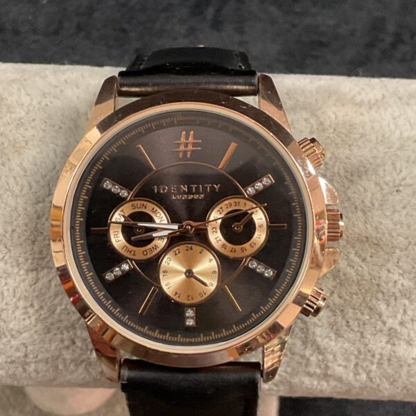 Stylish Identity London quartz wristwatch with black leather strap.
