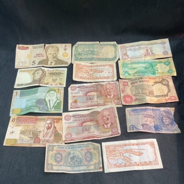 Collection of diverse overseas banknotes and foreign currency.