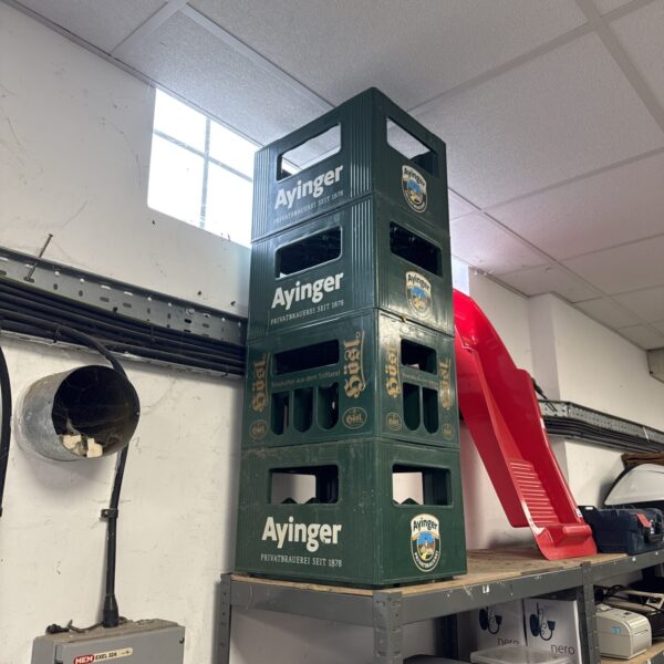 Vintage Ayinger beer crates, German brewery collectibles.