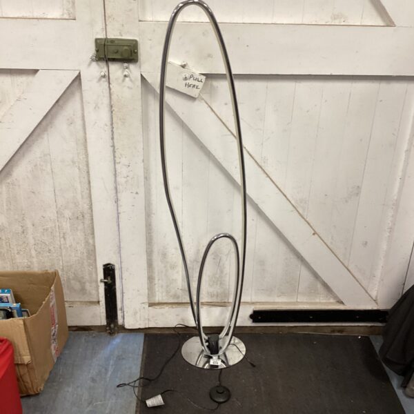 Polished chrome LED floor lamp with a modern, minimalist design.