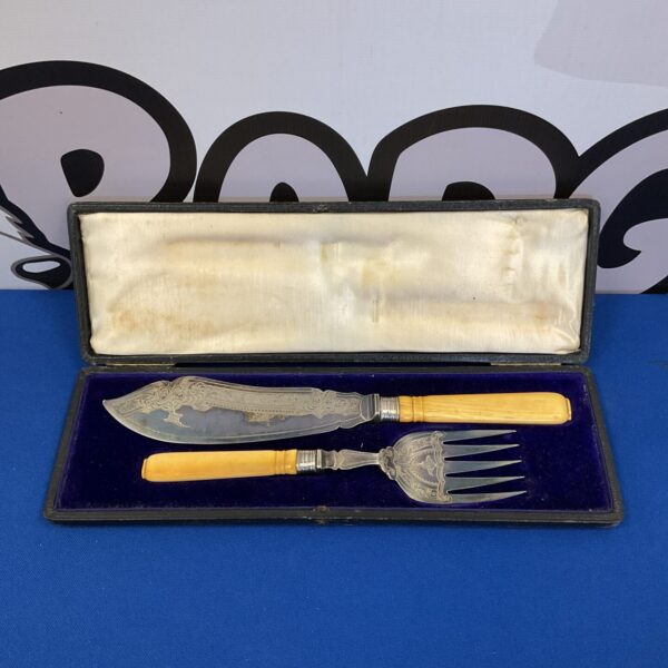 Antique bone handle cutlery set with silver plated blades.