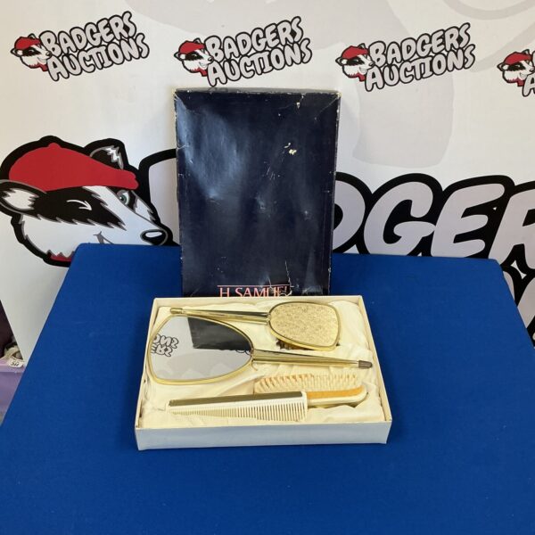 Vintage H Samuel dressing table set with silver plated accessories.