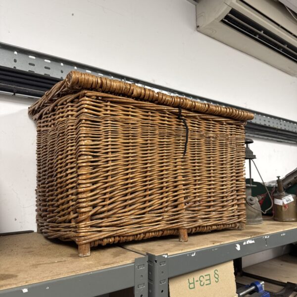 Vintage wicker hamper basket for laundry or storage.