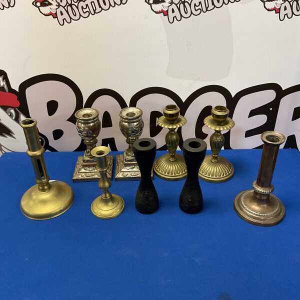 Vintage brass candlestick collection with Art Deco styles.