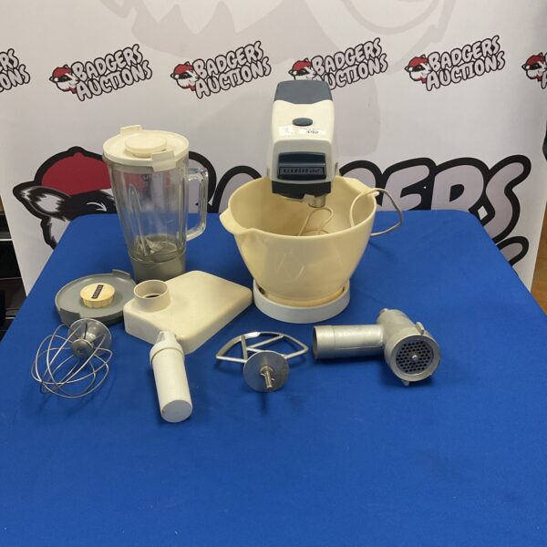 Vintage Kenwood Chef mixer with attachments for baking.