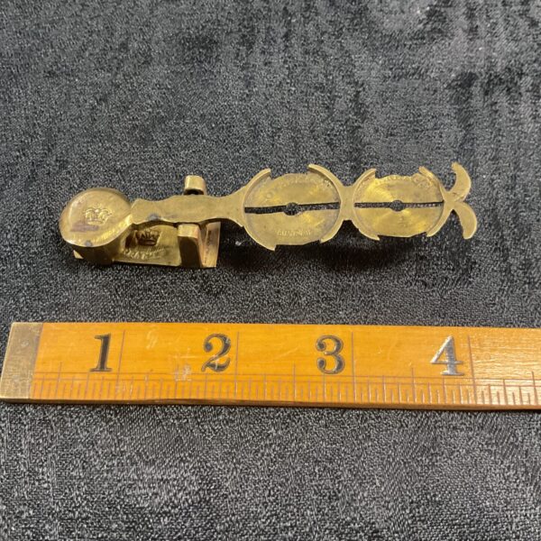 Victorian sovereign scales with ruler for scale.