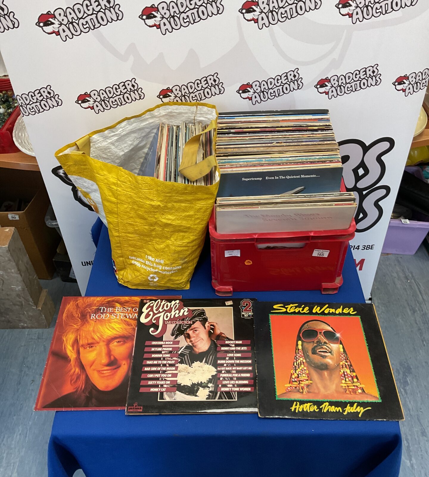 Box of 12” vinyl incl. Elton John and Stevie Wonder with bag of mixed vinyl incl. The Beach Boys