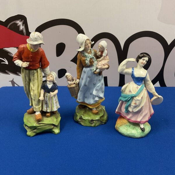 Antique Dutch porcelain figurines of a family scene.