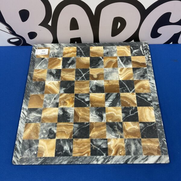 Elegant marble chess board with dark and light squares.