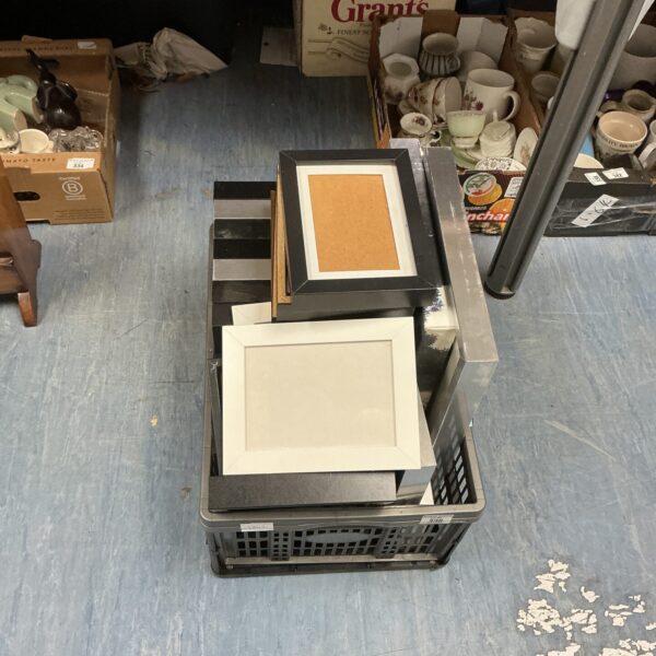 Mixed lot of assorted photo and picture frames on display.
