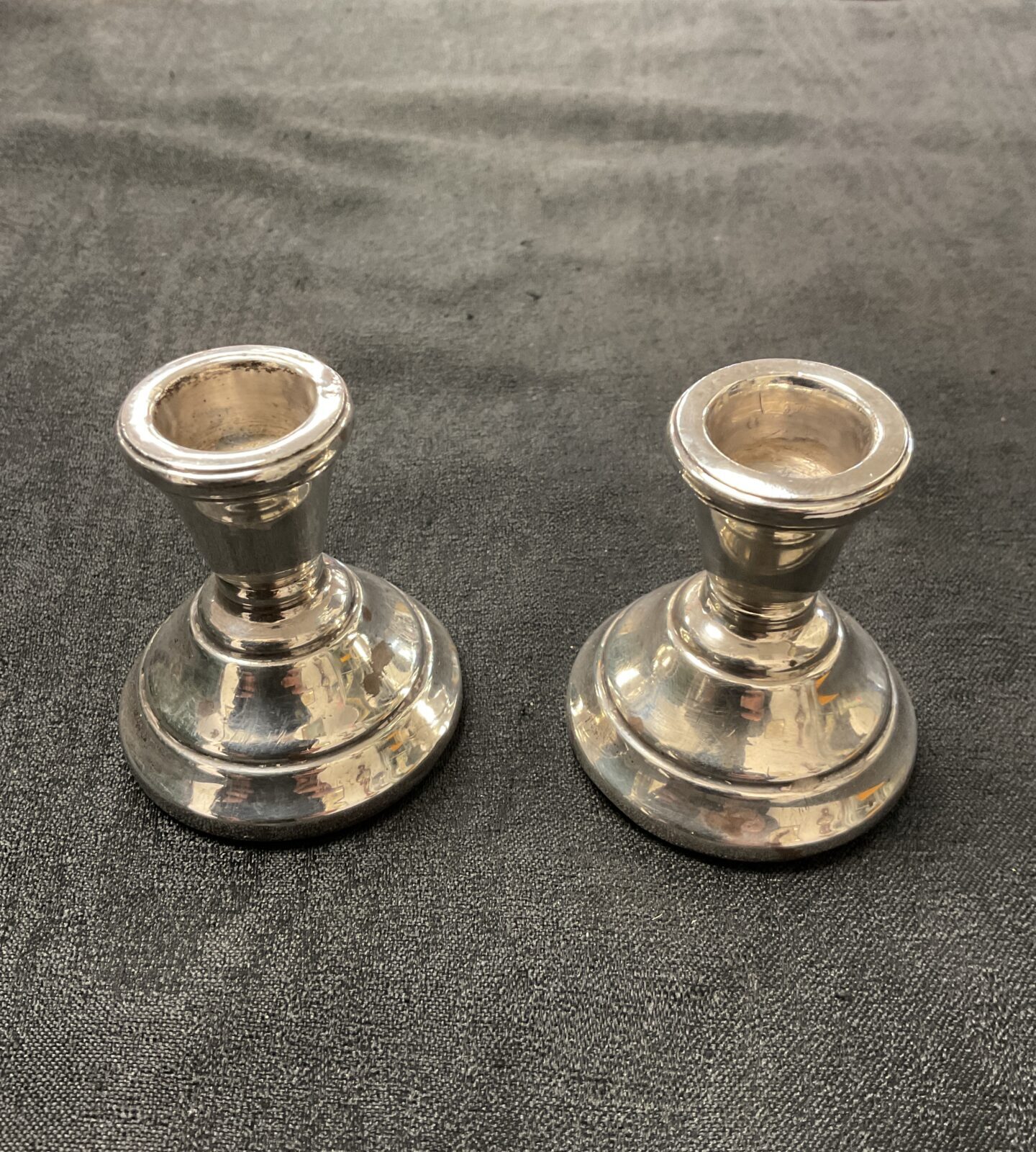 A pair of sterling silver hallmark candlesticks Birmingham maker S.M.4.485 ounces gross